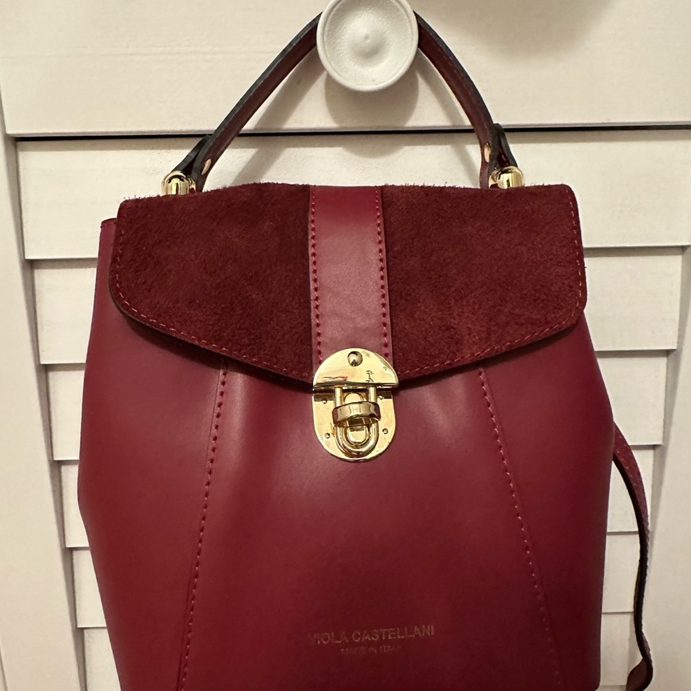 Viola Castellanos’s leather red backpack crossbody